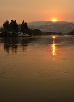 最上川と夕日