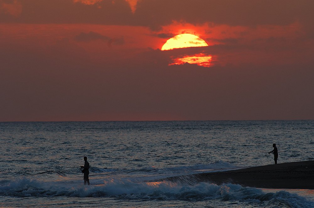 夕暮れの釣り人達