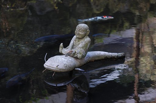 鯰に乗った少年