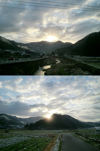 雪を冠った山からの朝日の出